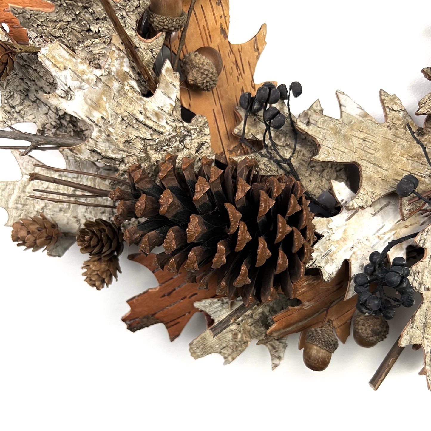 detail view of the fall elements on the dried natural wreath for thanksgiving