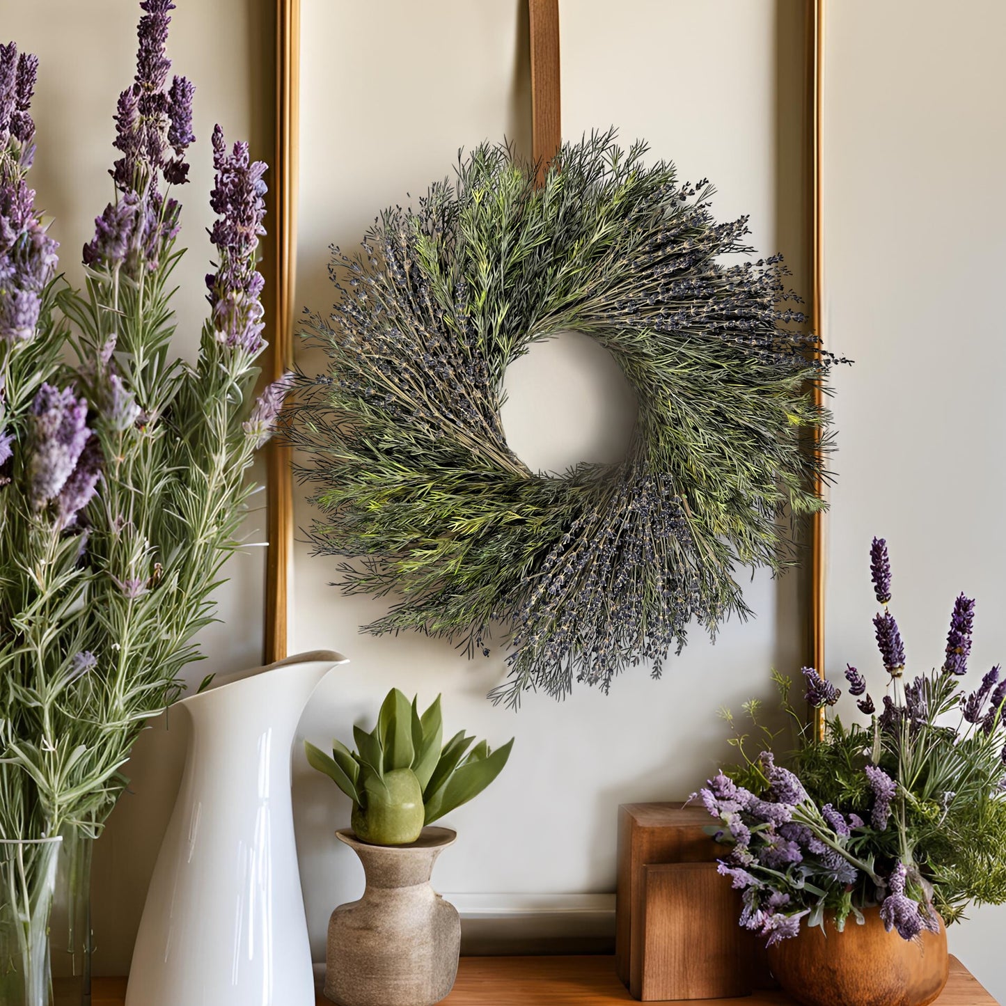 bohemian style preserved wreath hanging above a wooden table with lots of lavender decors on it