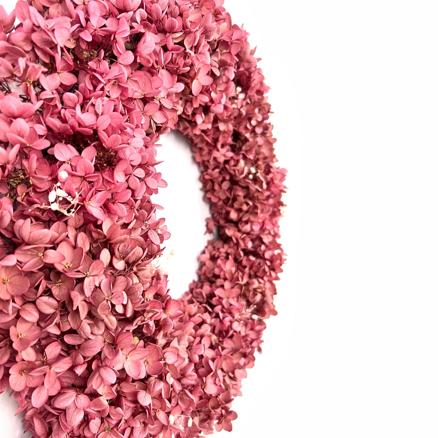 side view of the preserved pink hydrangea wreath showing depth and details