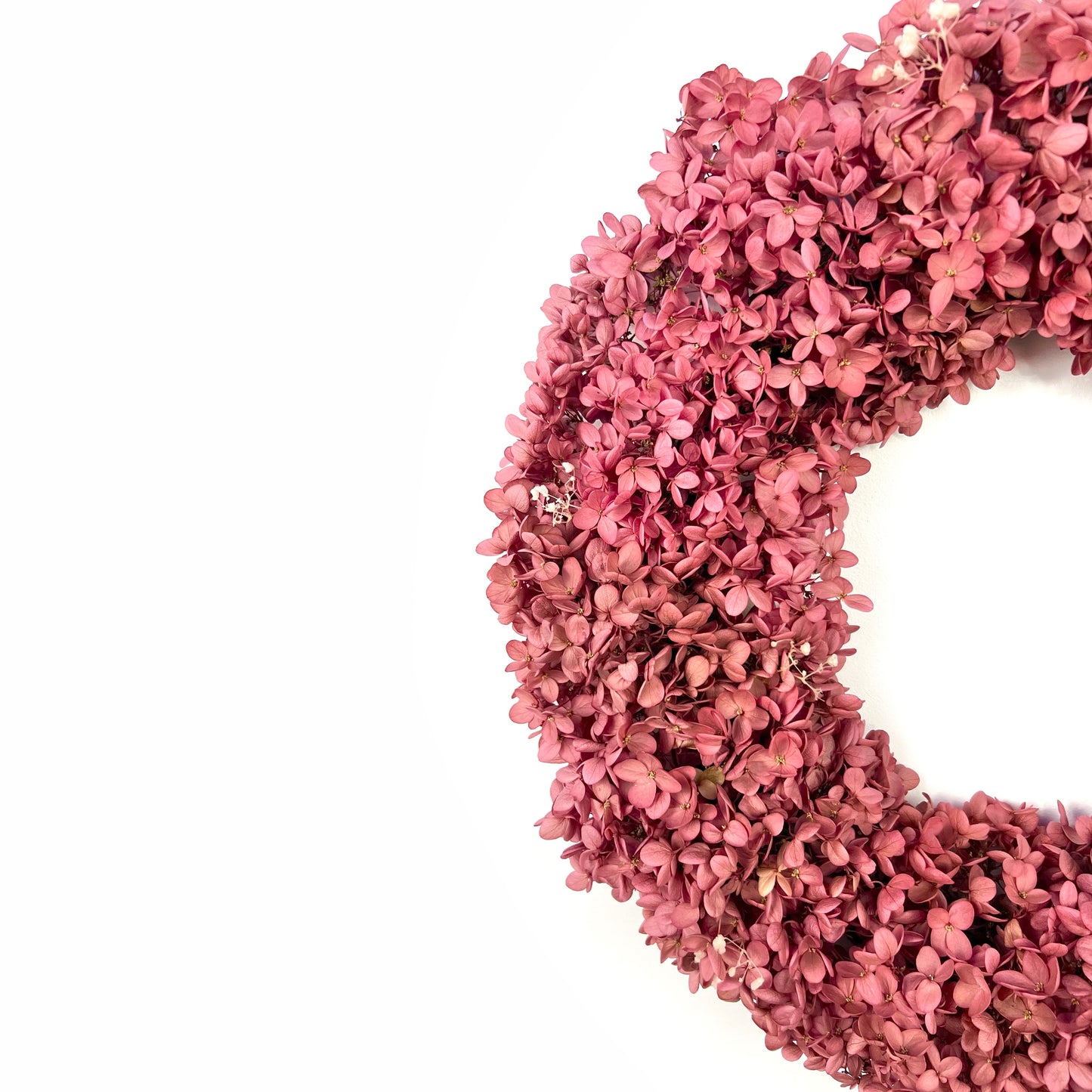 preserved light pink hydrangea wreath with white baby's breath flowers for spring decorations