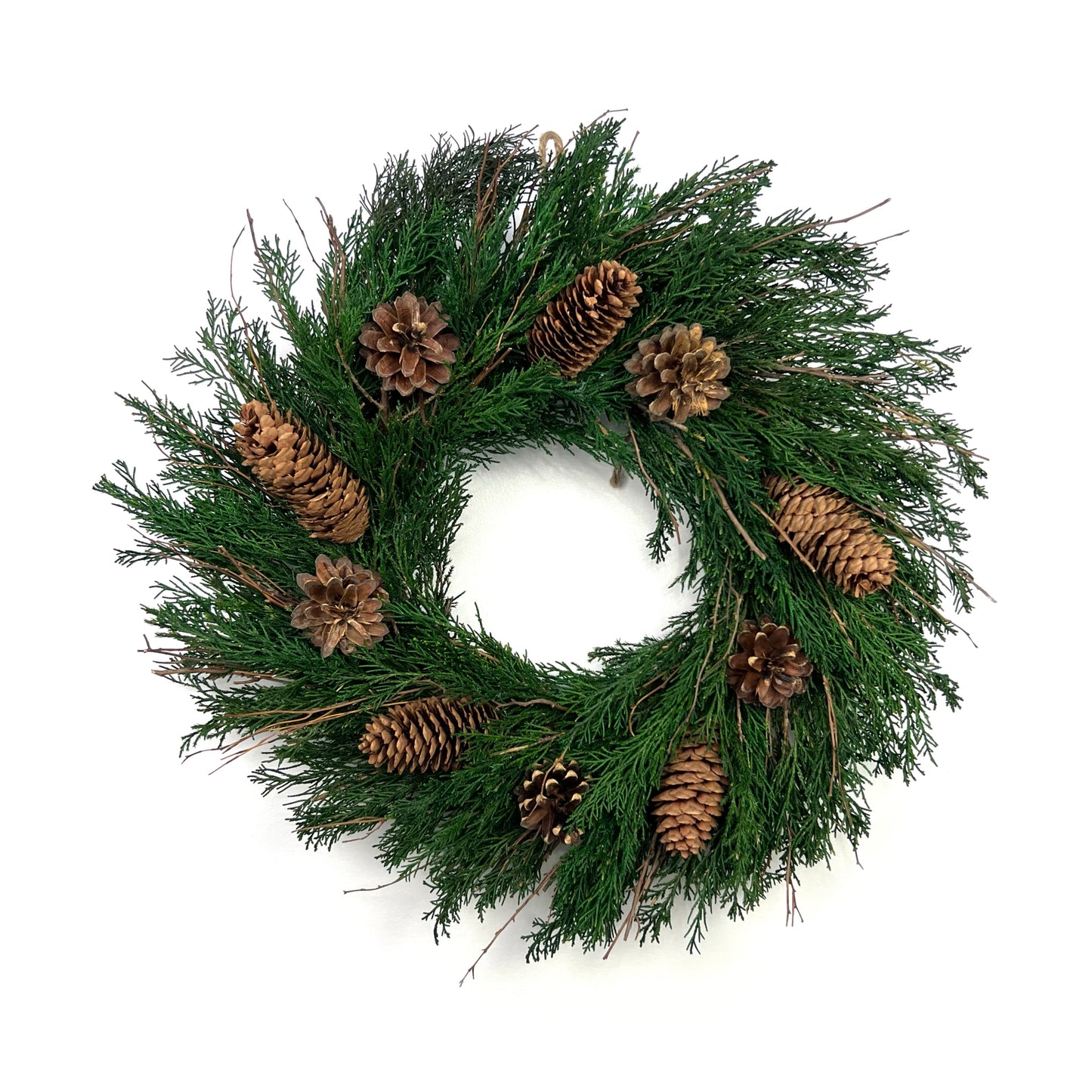 preserved juniper christmas wreath with pinecone decorations for vintage winter celebrations