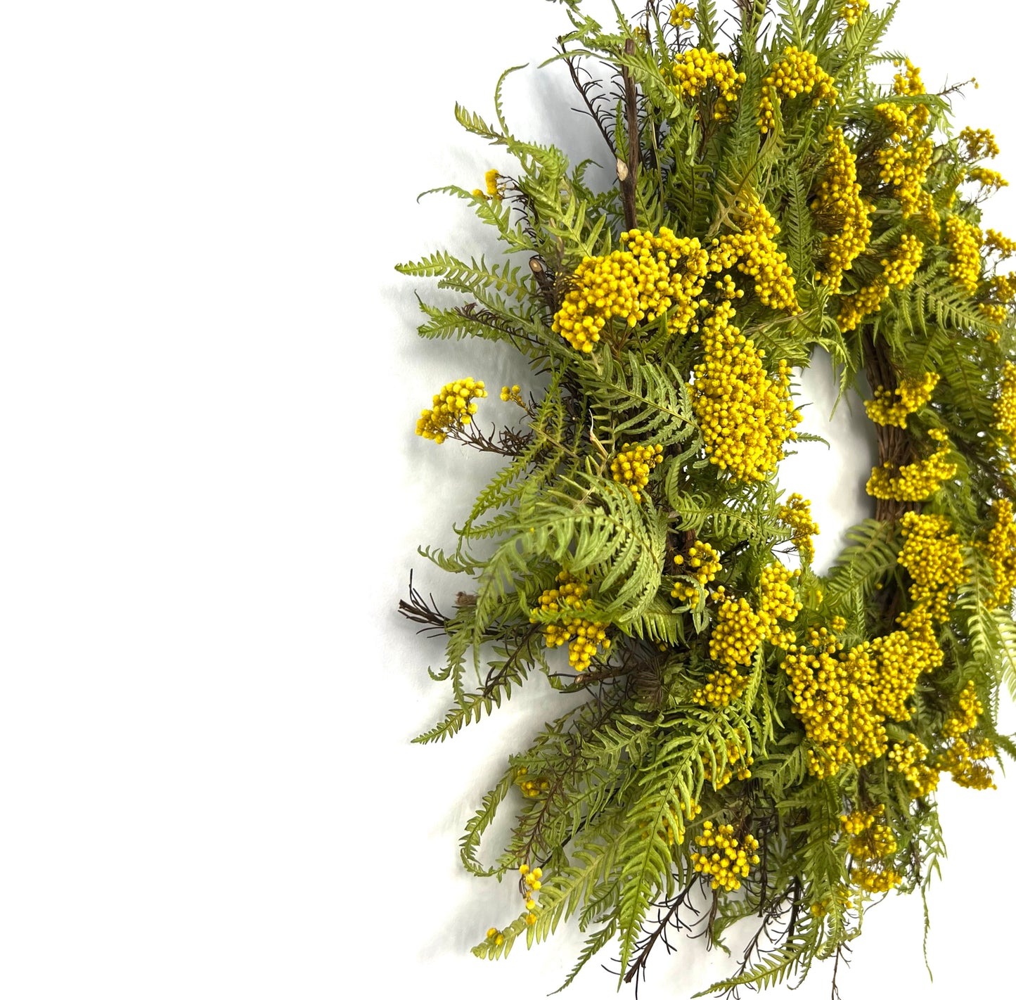 a side view showing the depth of the preserved natural wreath on the wall