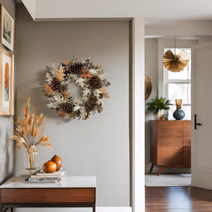 a handmade wreath with big pinecones on a beige wall in the foyer surrounded by neutral tone home decors
