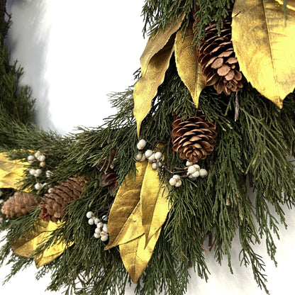 detailed view of the gold preserved olive leaves and tallow berries on the wreath 