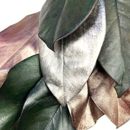 closeup look of the painted silver and copper tone magnolia leaves on the wreath