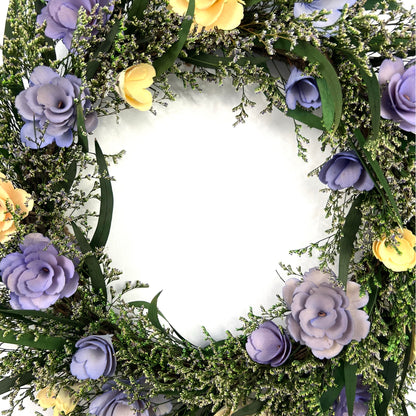center of the preserved eucalyptus wreath with handmade flowers made from wood chips