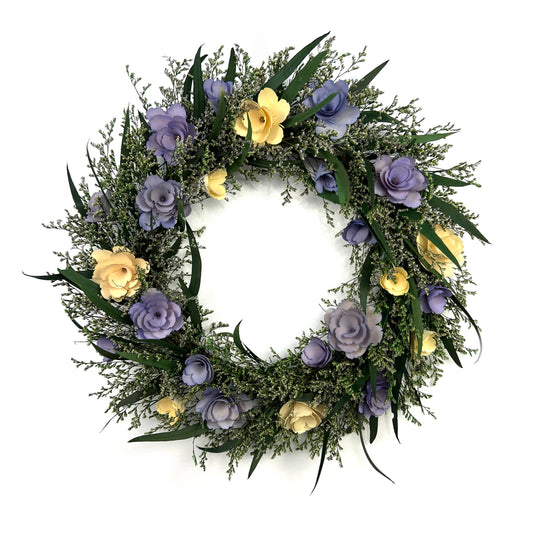 preserved eucalyptus wreath paired with pastel purple and white flowers ade from thin birch wood chips