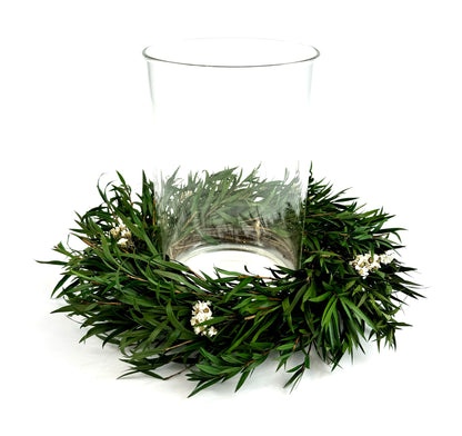small Christmas centerpiece with preserved candle ring wreath and glass candleholder