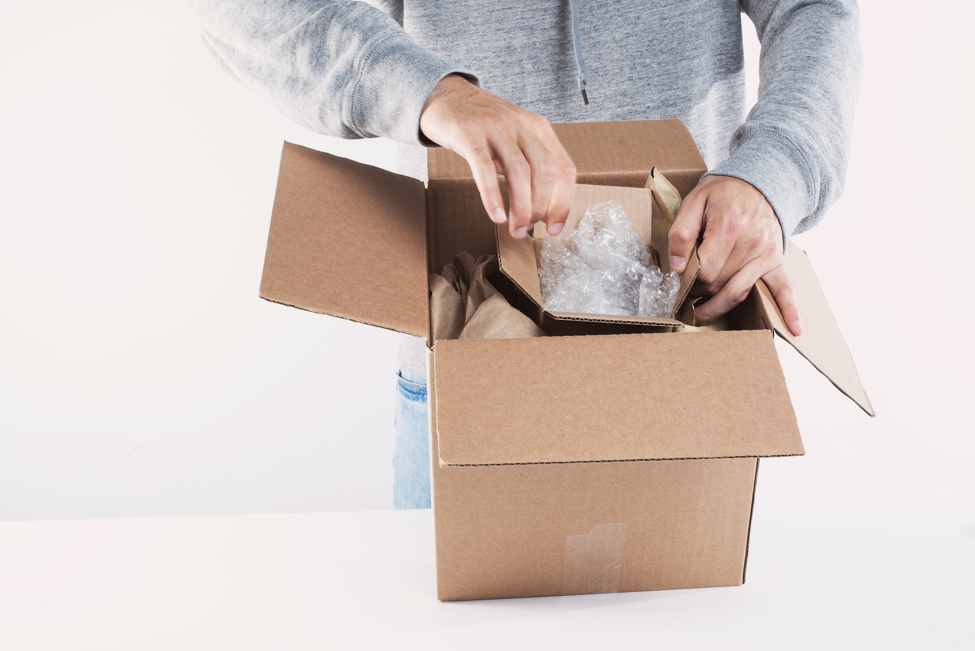young man opens a package